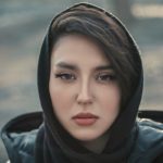 a woman with a scarf on her head